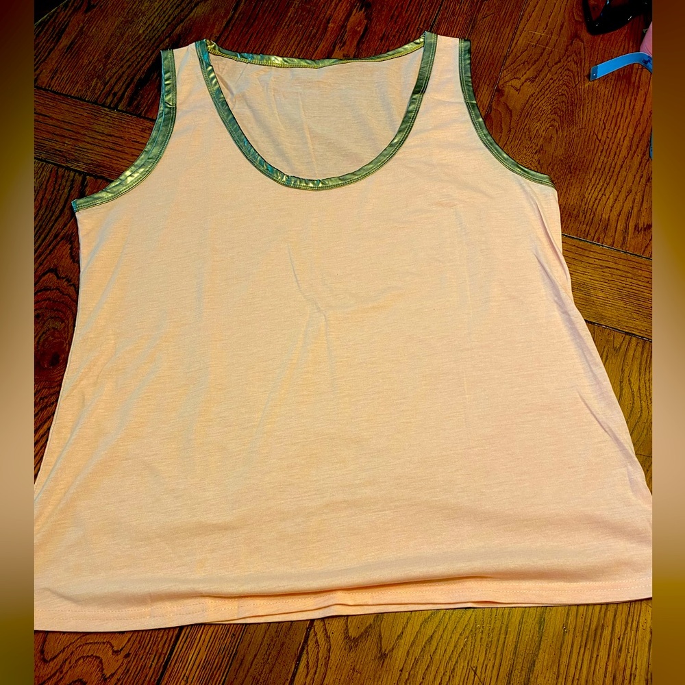 Light pink tank with metallic silver trim.